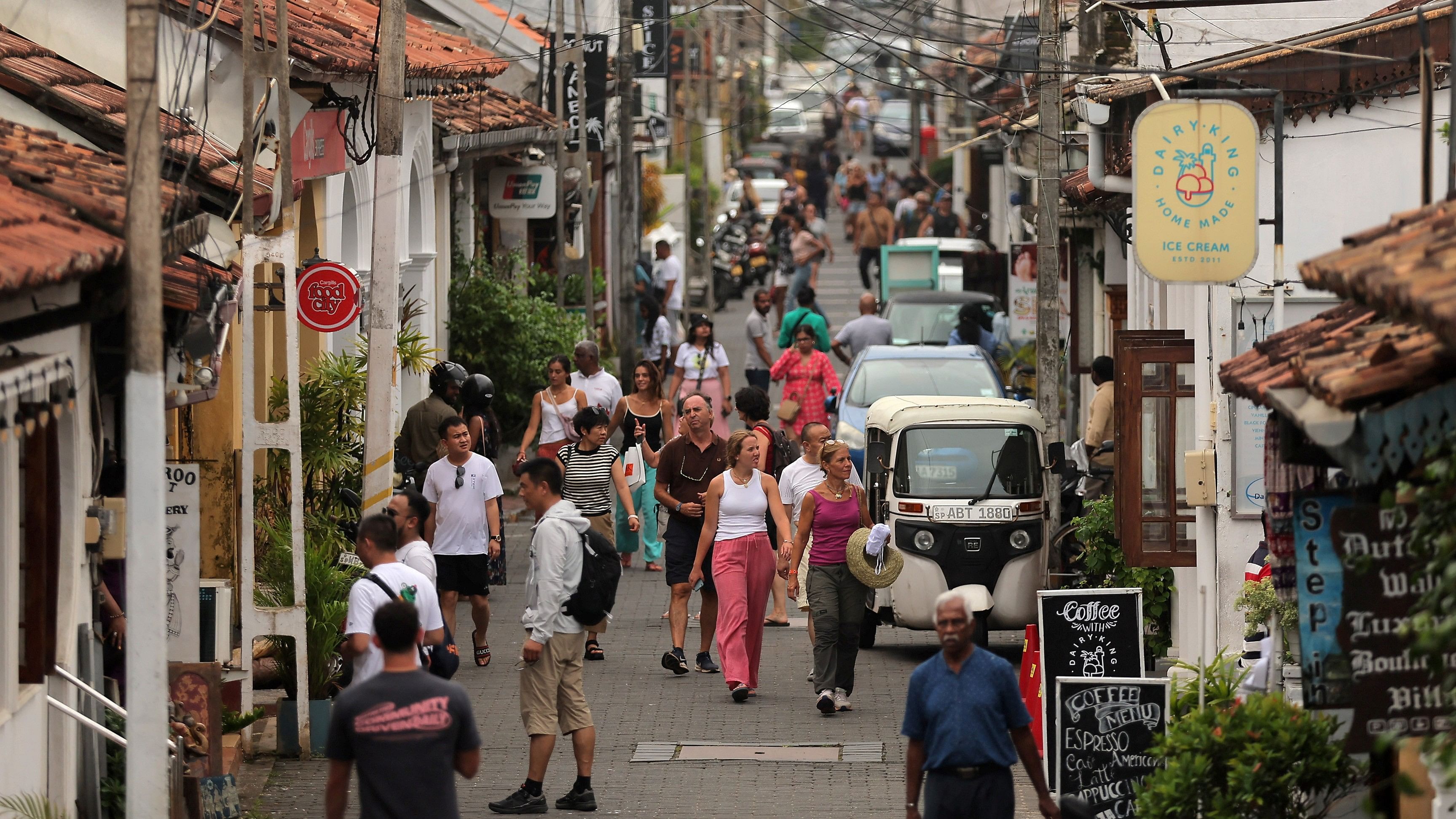 <div class="paragraphs"><p>People walk along a road in the Dutch Fort, in Galle, Sri Lanka</p></div>